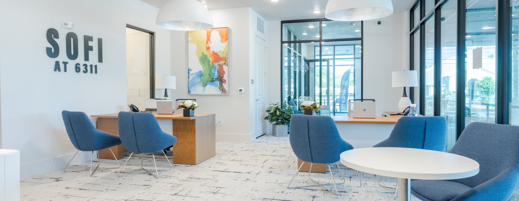 Leasing office with seating, tables and desks