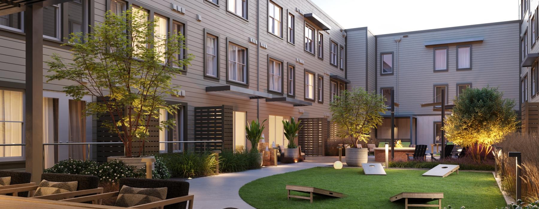 a courtyard with tables and chairs